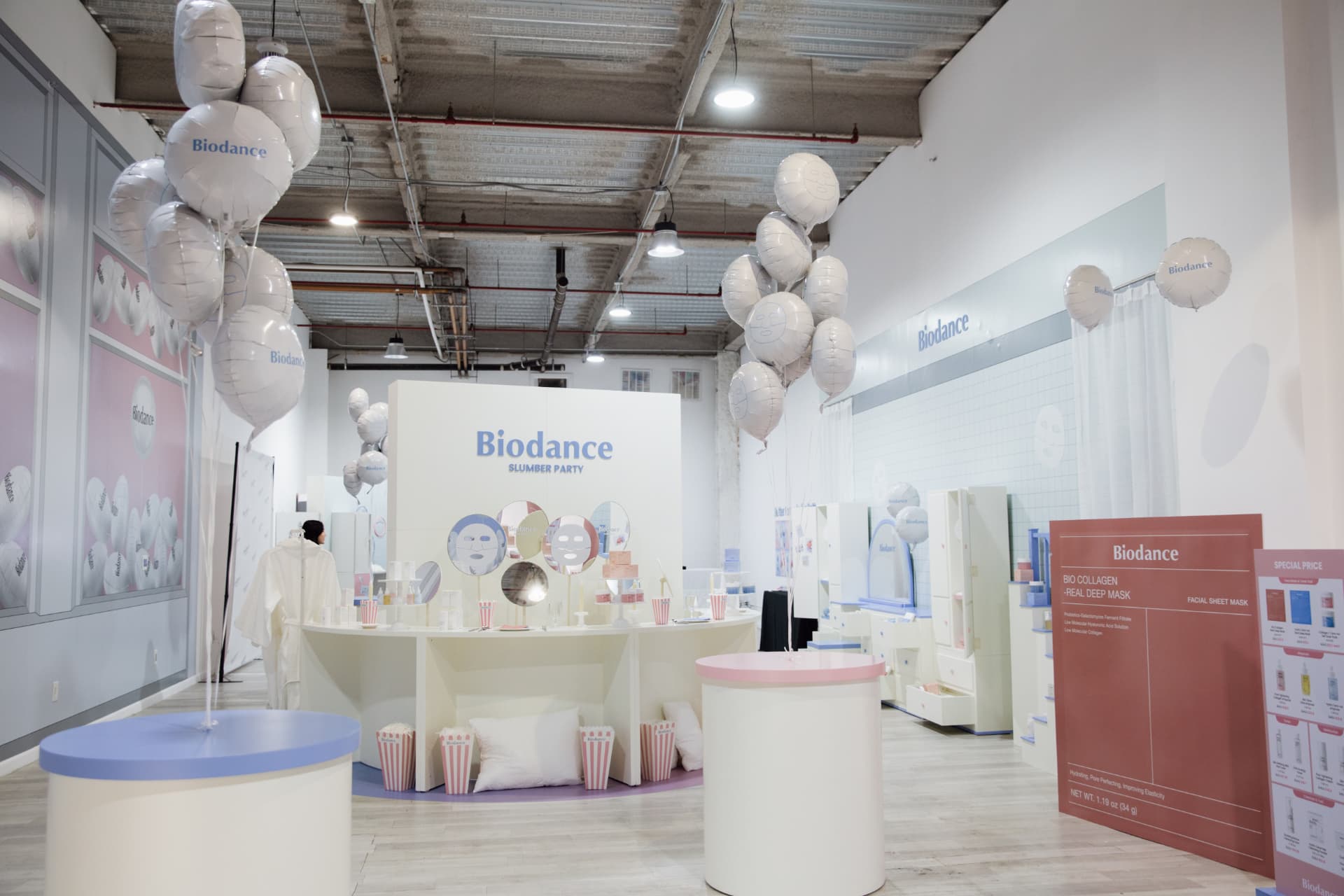 Biodance Slumber Party pop-up venue in New York with branded balloons and product displays