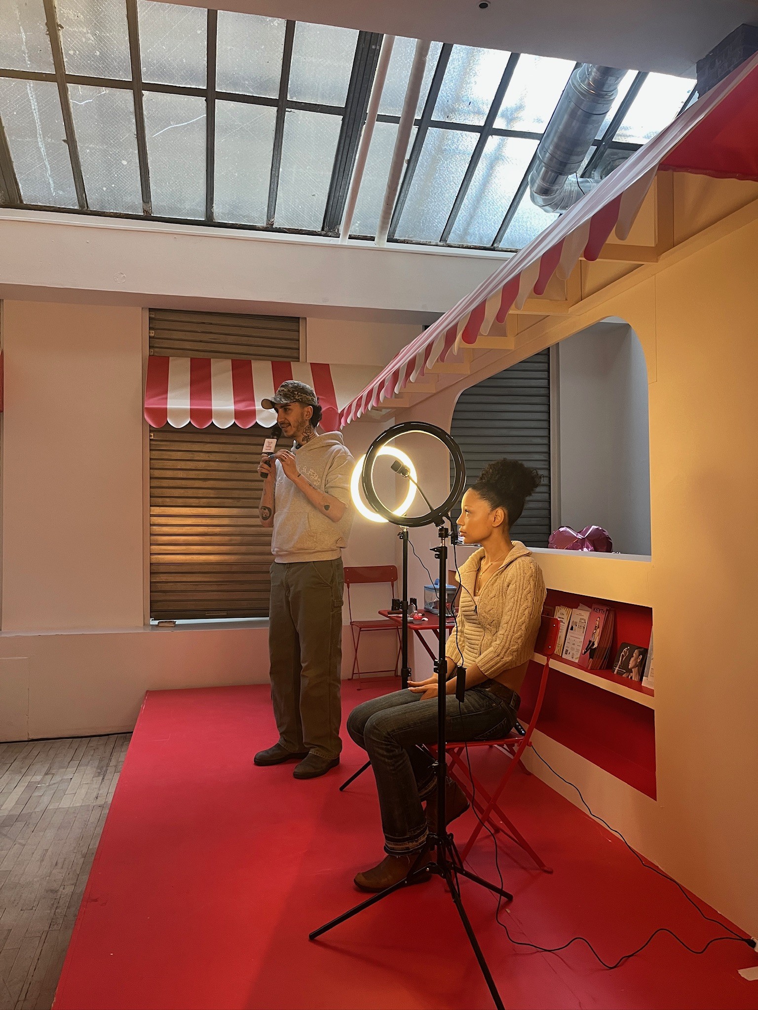 Artist applying makeup during the live creator session at the Beauty Bakery pop-up