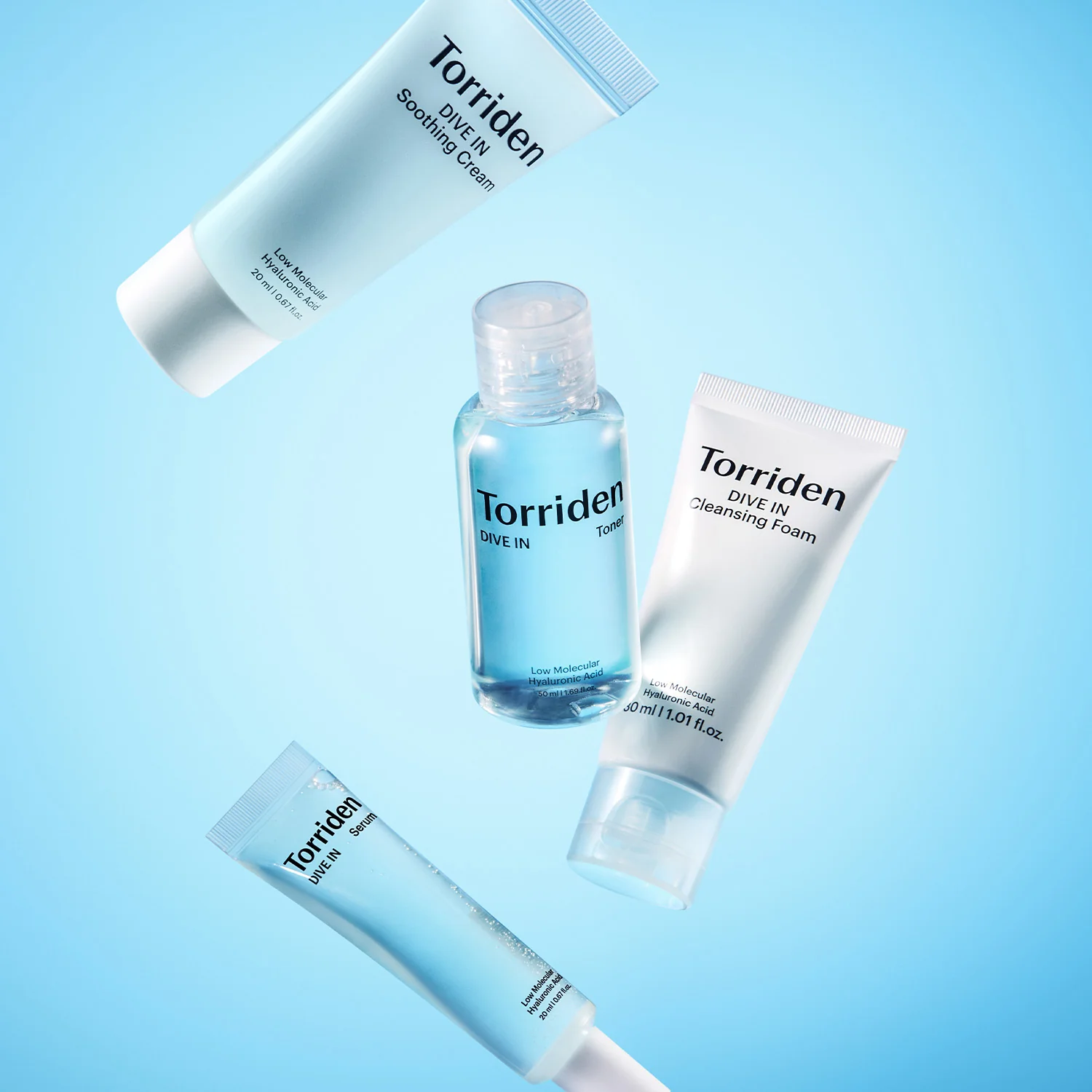 Torriden Dive In product family — toner, serum, cleansing foam and soothing cream on a soft blue backdrop